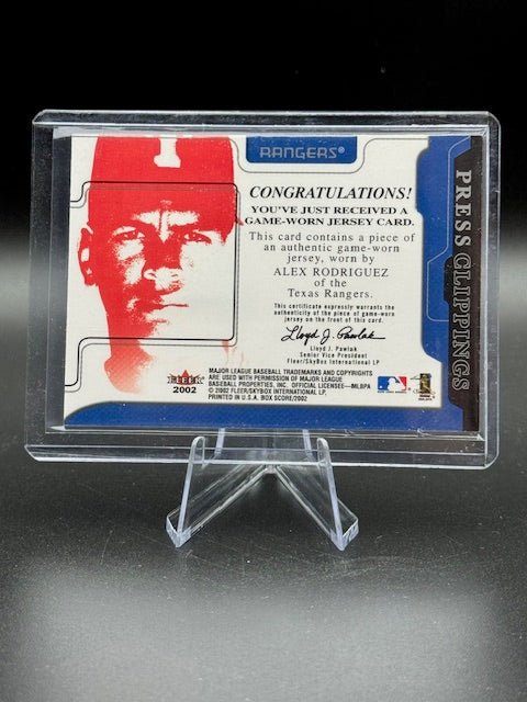 2002 Fleer Press Clippings Game Worn Jersey Piece Alex Rodriguez - Curators Corner LLC